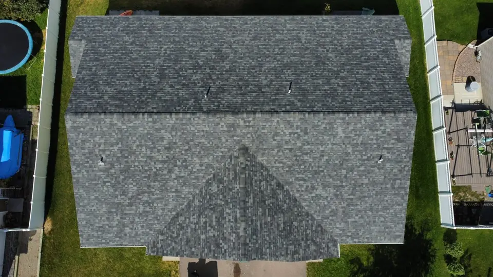 Drone aerial of a gray shingle roof on a northwest Montana home